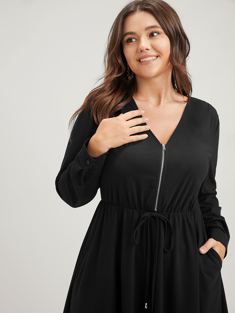 

Plus Size Solid Zipper Pocket Flutter Drawstring Asymmetrical Hem Dress Black Women Office Zipper V-neck Long Sleeve Curvy Midi Dress BloomChic