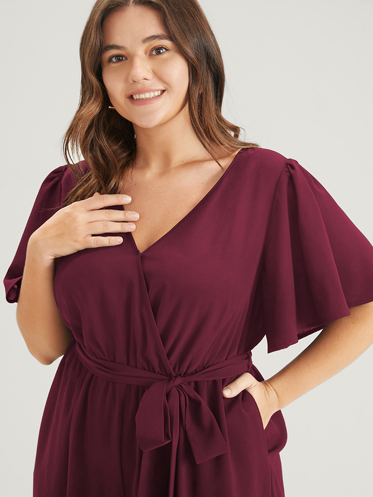 Plus Size Maroon Plain Scalloped Pocket Ruffles Button Belted Laser Cut Wrap Jumpsuit Women Elegant Short sleeve V-neck Dailywear Loose Jumpsuits BloomChic 30/6X 