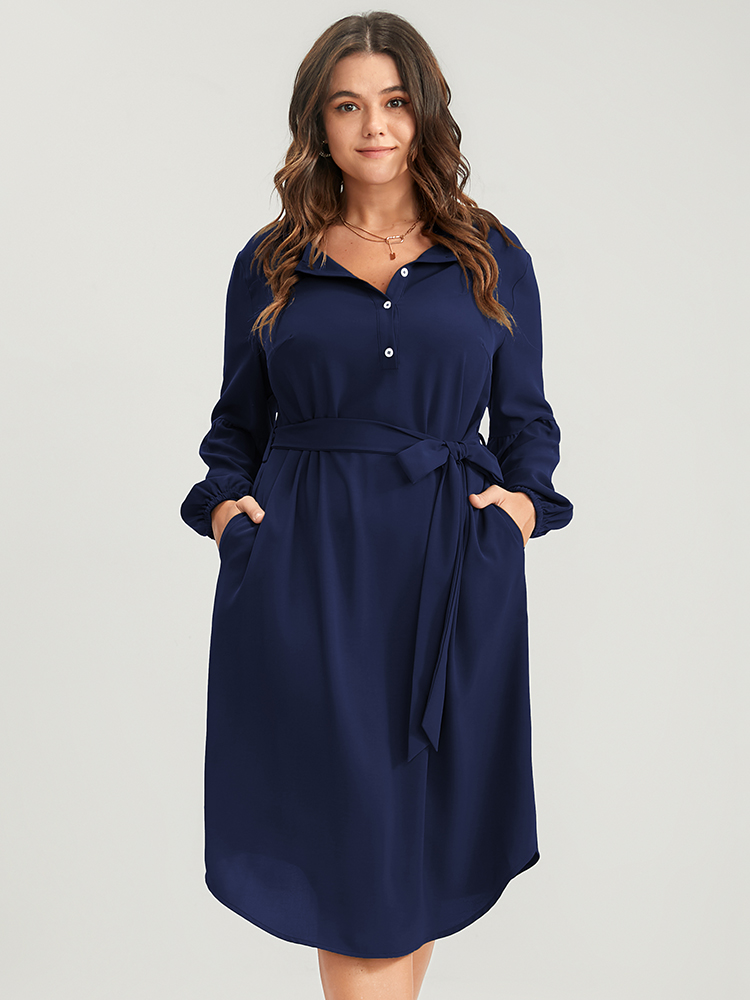 

Plus Size Solid Lantern Sleeve Button Pocket Belted Arc Hem Dress Navy Women Office Belted Round Neck Long Sleeve Curvy Midi Dress BloomChic