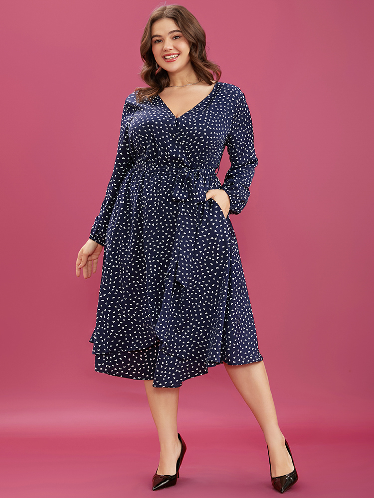 Plus Size Heart Print Surplice Neck Pocket Asymmetrical Belted Flutter Dress Navy Women Elegant Pocket V-neck Long Sleeve Curvy Midi Dress BloomChic 28/5X 