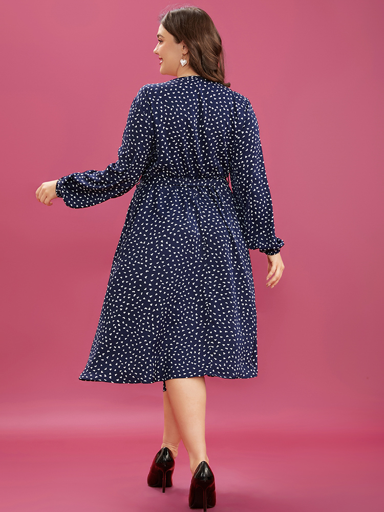 Plus Size Heart Print Surplice Neck Pocket Asymmetrical Belted Flutter Dress Navy Women Elegant Pocket V-neck Long Sleeve Curvy Midi Dress BloomChic 28/5X 