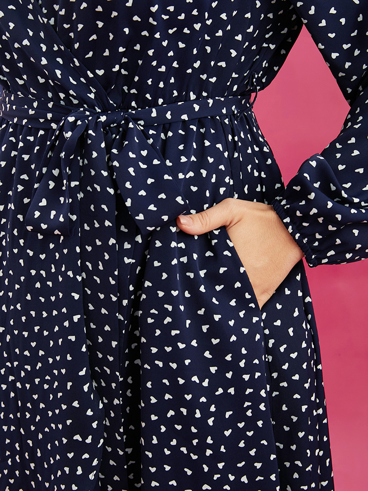 Plus Size Heart Print Surplice Neck Pocket Asymmetrical Belted Flutter Dress Navy Women Elegant Pocket V-neck Long Sleeve Curvy Midi Dress BloomChic 28/5X 