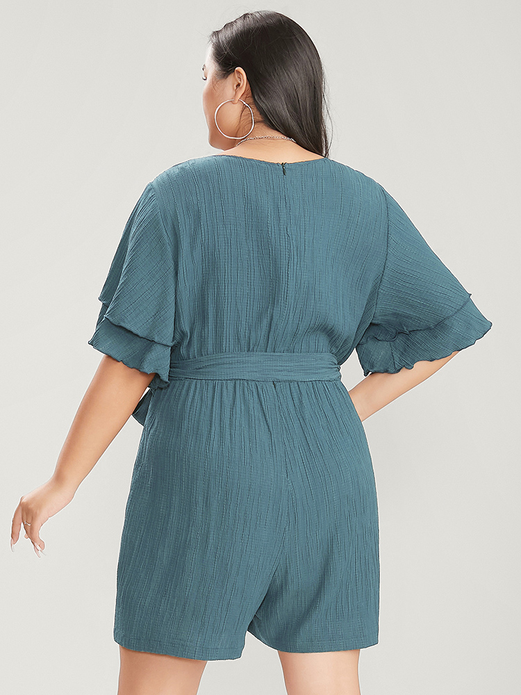 

Plus Size Cerulean Plain Surplice Neck Ruffle Sleeve Pocket Belted Romper Women Elegant Short sleeve V-neck Dailywear Loose Jumpsuits BloomChic