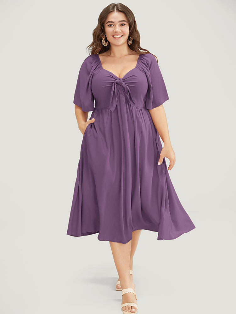 

Plus Size Solid V Neck Ruched Knotted Pocket Ruffle Hem Dress Mauve Women Elegant Ruched V-neck Short sleeve Curvy Midi Dress BloomChic