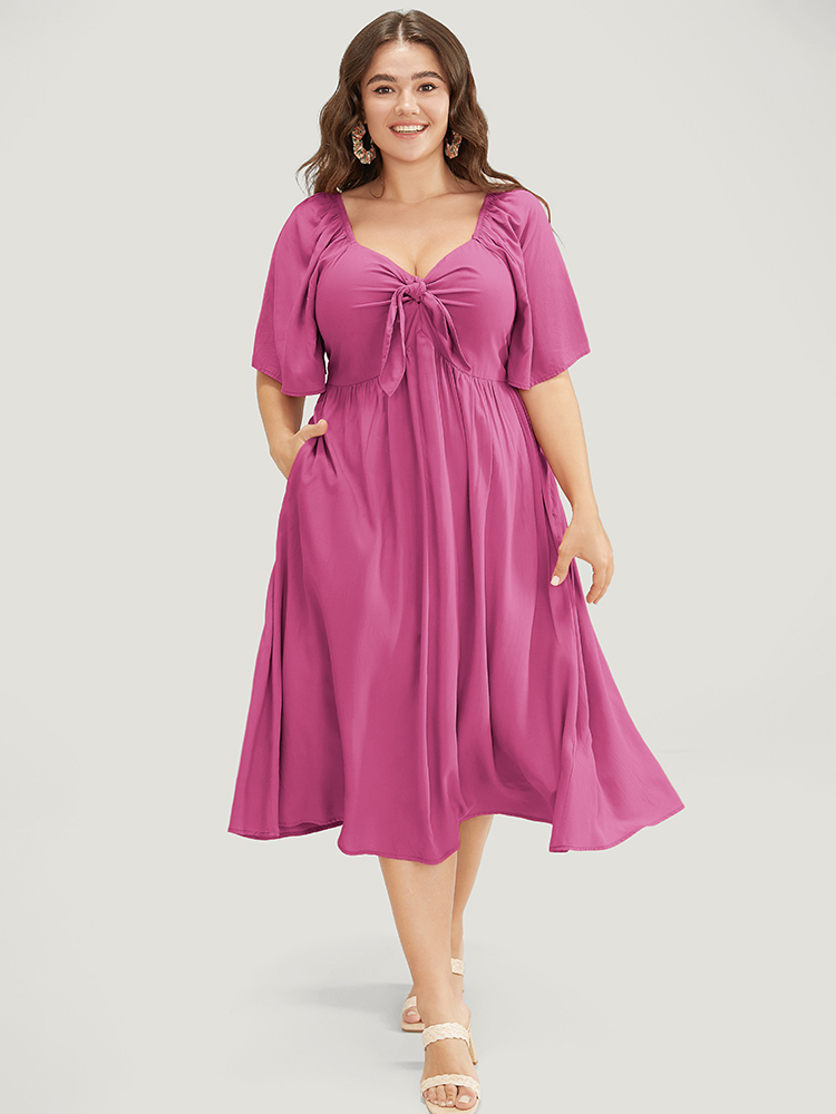 

Plus Size Solid V Neck Ruched Knotted Pocket Ruffle Hem Dress RedViolet Women Elegant Ruched V-neck Short sleeve Curvy Midi Dress BloomChic