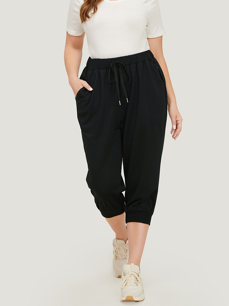 

Plus Size Solid Knot Front Pocket Carrot Pants Women Black Casual High Rise Dailywear Pants BloomChic