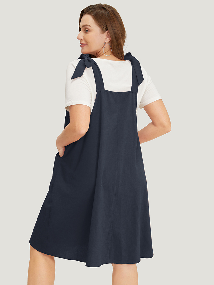 

Plus Size Solid Pleated Hem Pocket Tie Shoulder Overall Dress Navy Women Casual Pleated Spaghetti Strap Sleeveless Curvy Knee Dress BloomChic