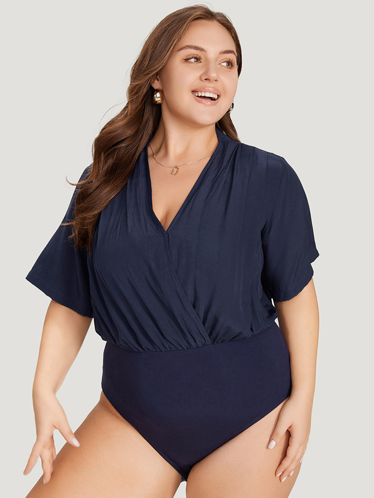 

Plus Size Solid Overlap Collar Pleated Bodysuit Women Indigo Plain Wrap Bodysuits BloomChic