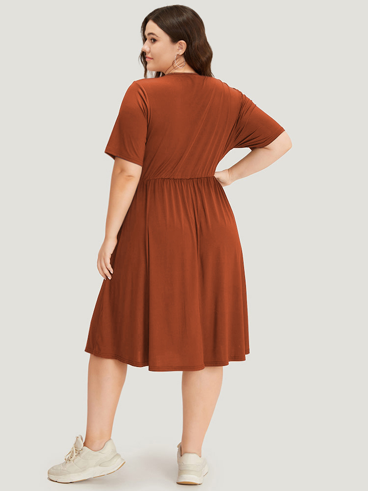 

Plus Size Supersoft Essentials Solid Surplice Neck Ruched Front Dress Rust Women Casual Wrap V-neck Short sleeve Curvy Midi Dress BloomChic