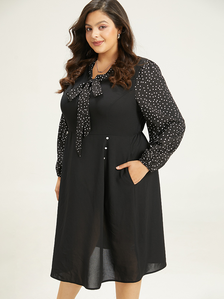 

Plus Size Polka Dot Ties Pocket Button Detail Dress Black Women Office Elastic cuffs Tie Neck Long Sleeve Curvy Knee Dress BloomChic