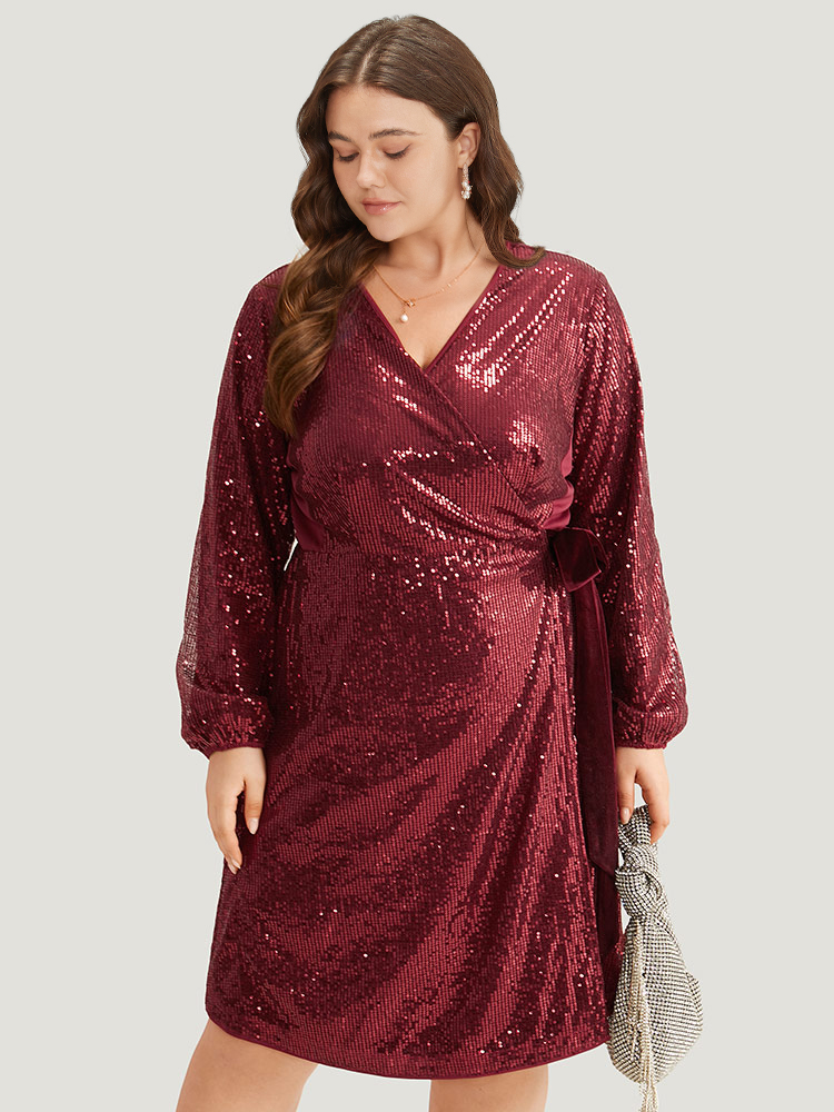 

Plus Size Sequin Ties Side Surplice Neck Lantern Sleeve Dress Scarlet Women Cocktail Elastic cuffs V-neck Long Sleeve Curvy Knee Dress BloomChic