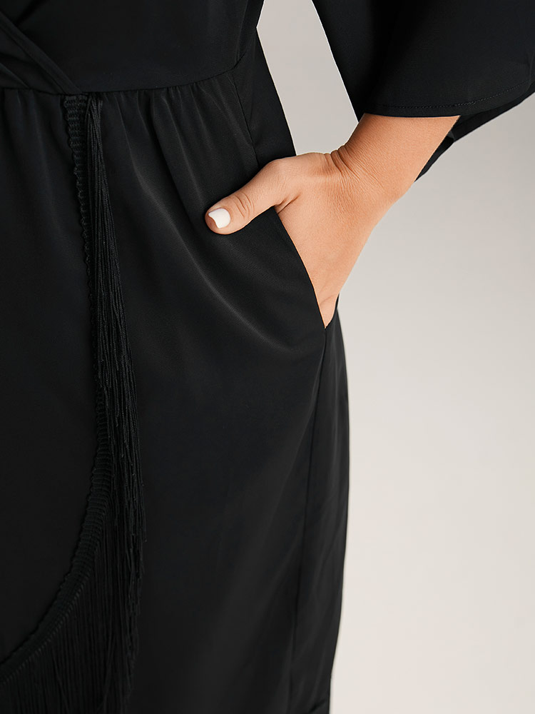 Plus Size Plain Wrap Tassel Trim Pleated Dress Black Women Cocktail Tassels V-neck Elbow-length sleeve Curvy Midi Dress BloomChic 14-16/1X 
