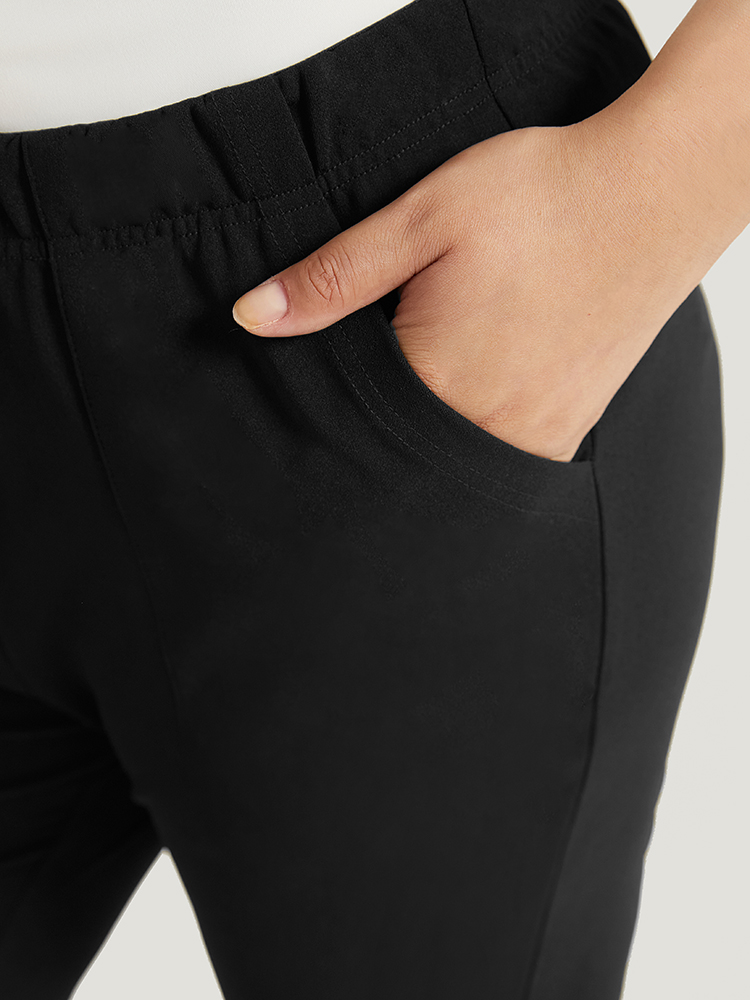 

Plus Size Solid Pocket Flare Leg Elastic Waist Pants Women Black At the Office Flare Leg High Rise Work Pants BloomChic