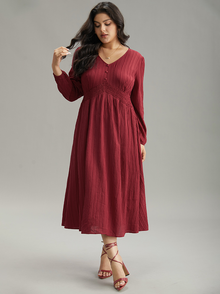 

Plus Size Solid Plisse Button Detail Shirred Dress Scarlet Women Elegant Elastic cuffs V-neck Long Sleeve Curvy Midi Dress BloomChic