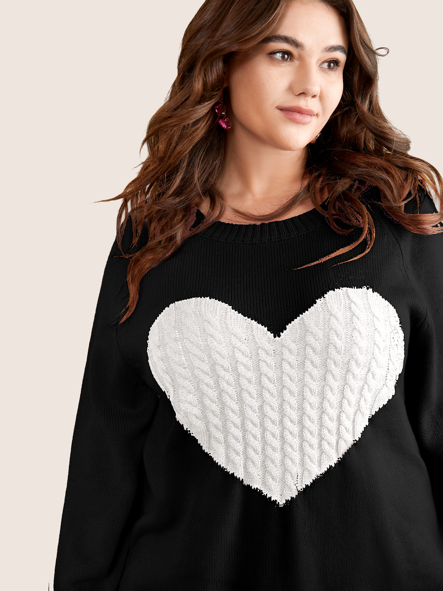Side view of BloomChic Women's Plus Size Heart Cable Knit Two Tone Raglan Sleeve Pullover Black 26/4X