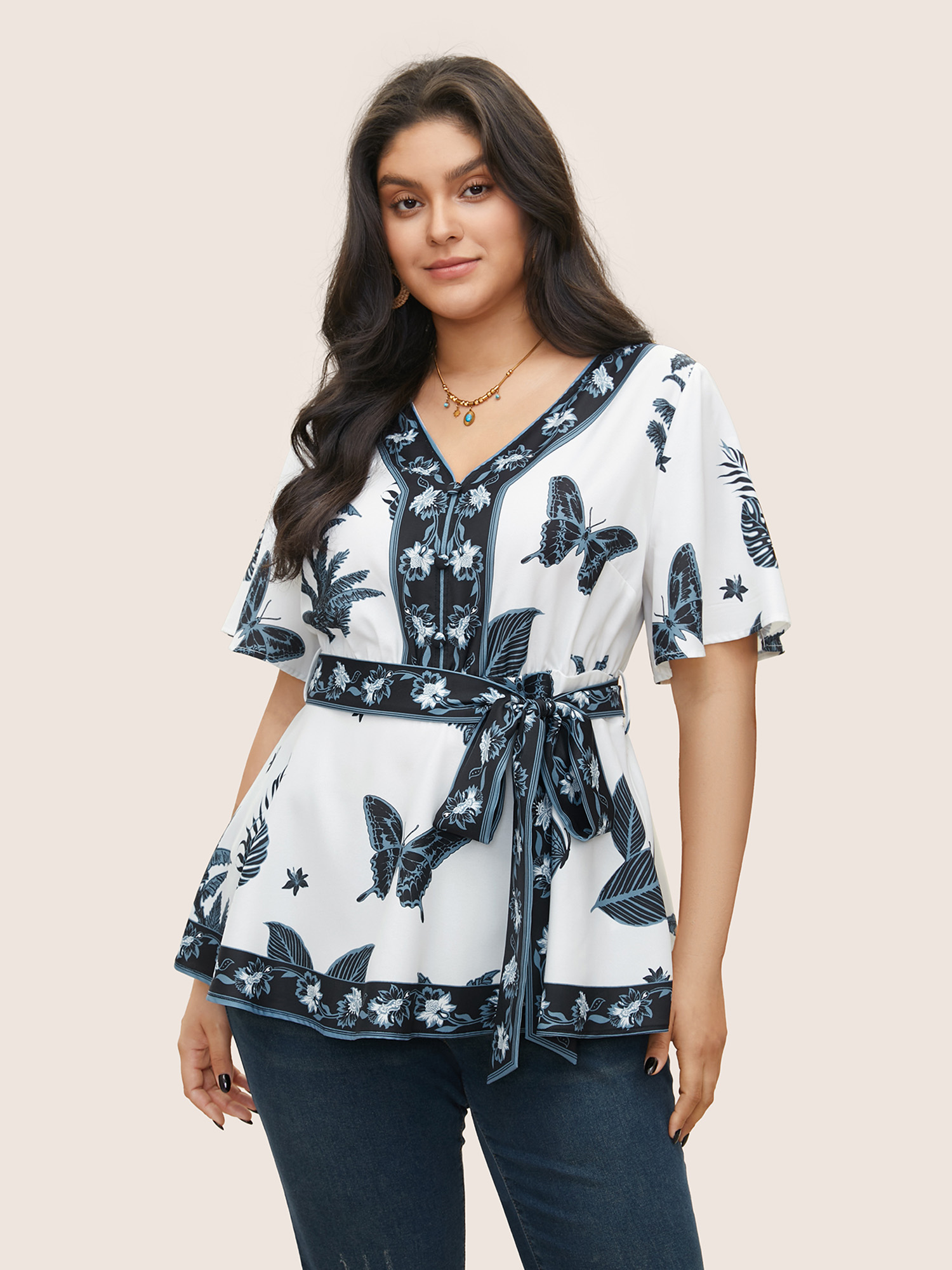 

Plus Size Ivory Boho Print Belted Flutters Blouse Women Resort Short sleeve V-neck Vacation Blouses BloomChic