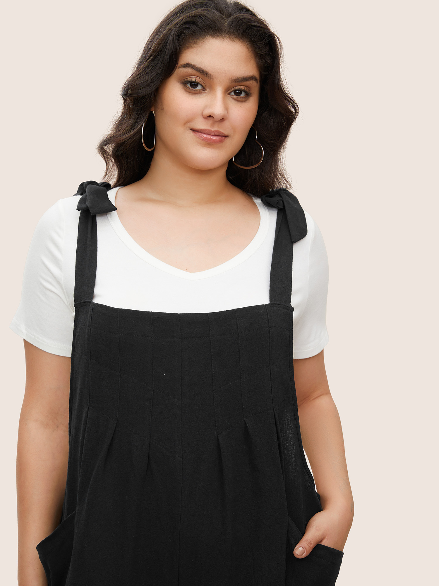 

Plus Size Black Solid Pleated Detail Pocket Knotted Shoulder Overall Jumpsuit Women Casual Sleeveless Non Everyday Loose Jumpsuits BloomChic