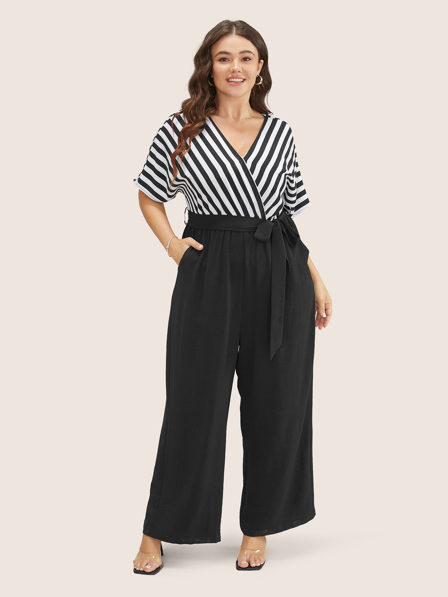 

Plus Size Black Striped Patchwork Pocket Batwing Sleeve Belted Wrap Jumpsuit Women At the Office Short sleeve Overlap Collar Work Loose Jumpsuits BloomChic