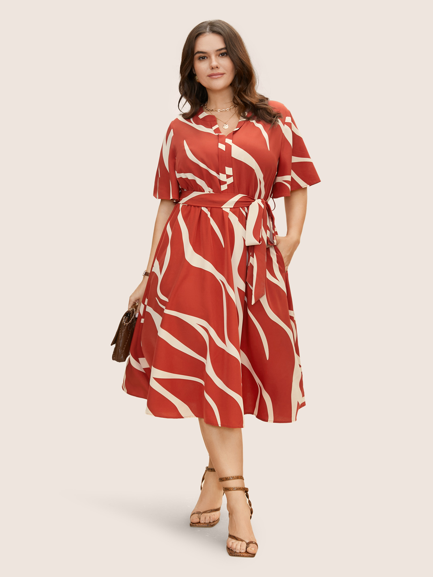 

Plus Size Geometric Surplice Neck Tie Knot Midi Dress Rust Women Belted Flat collar with V-notch Short sleeve Curvy BloomChic