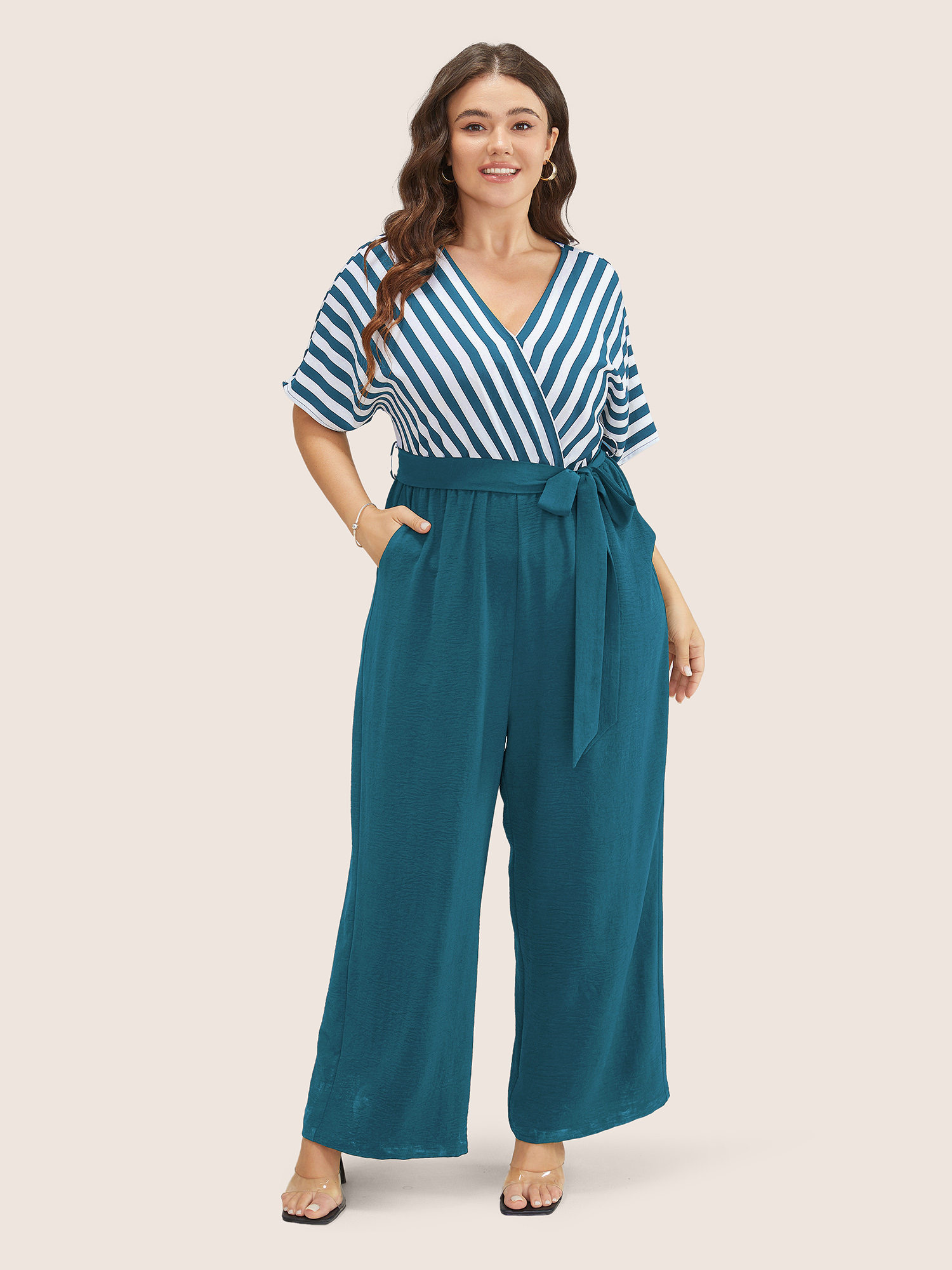 

Plus Size Mediumblue Striped Patchwork Pocket Batwing Sleeve Belted Wrap Jumpsuit Women At the Office Short sleeve Overlap Collar Work Loose Jumpsuits BloomChic