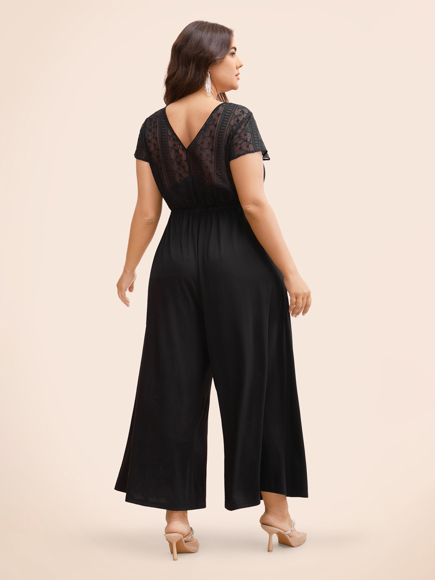 

Plus Size Black Overlap Collar Drawstring Mesh Cap Sleeve Jumpsuit Women Formal Cap Sleeve Overlap Collar Party Loose Jumpsuits BloomChic