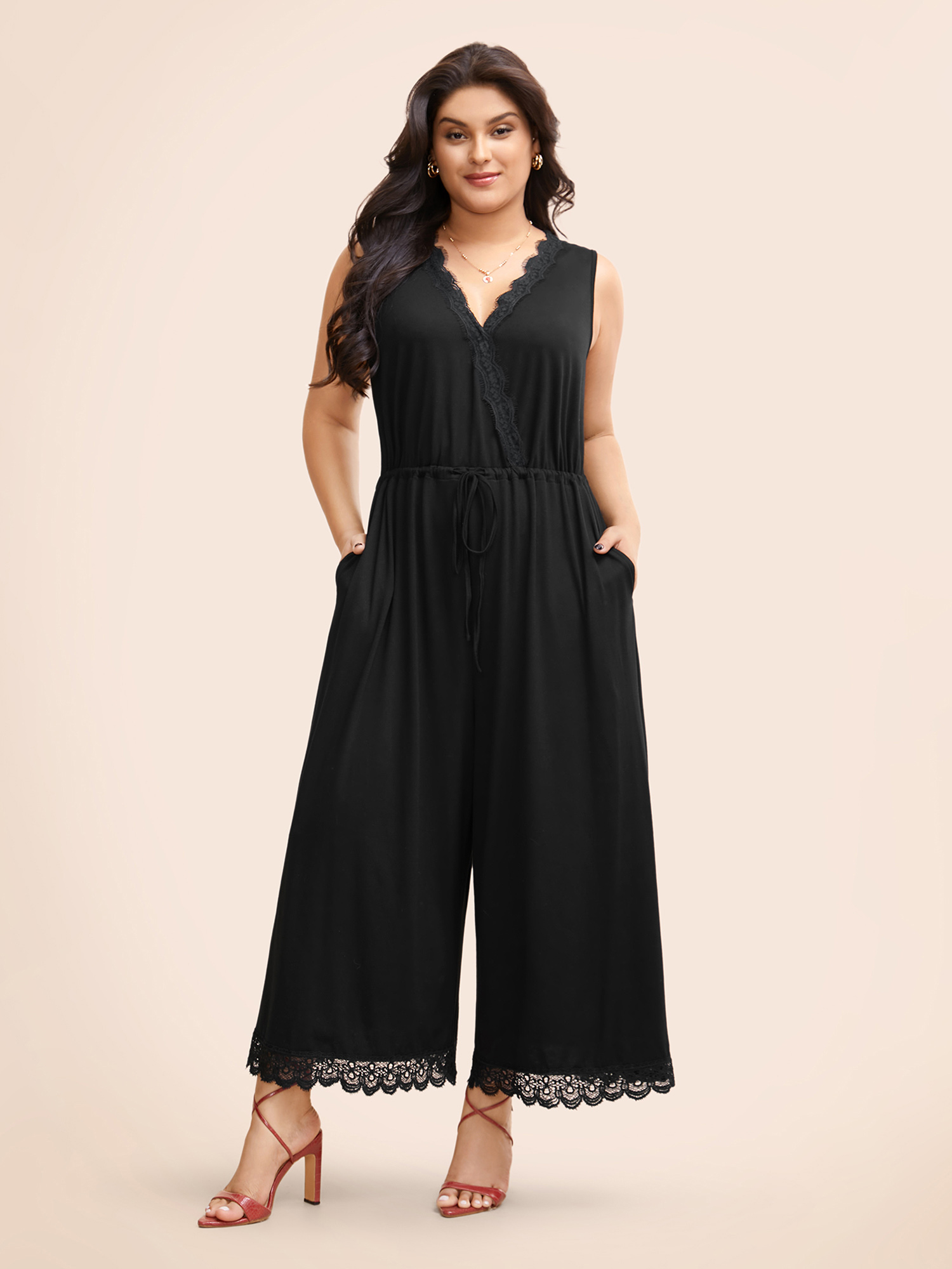 

Plus Size Black Overlap Collar Lace Trim Drawstring Jumpsuit Women Elegant Sleeveless Overlap Collar Everyday Loose Jumpsuits BloomChic