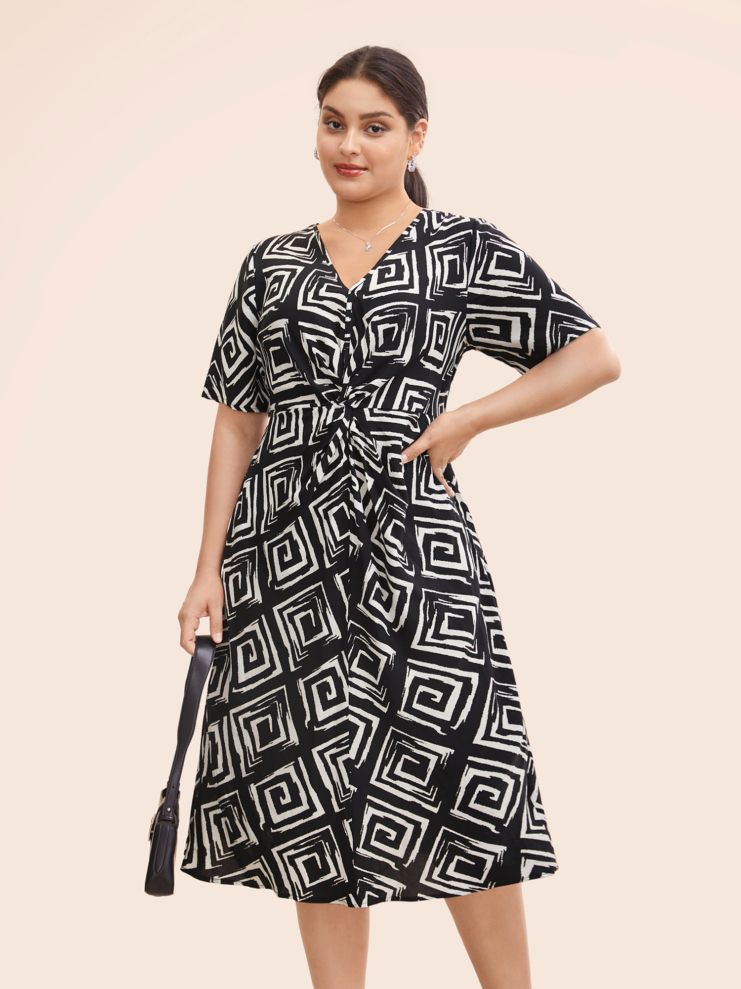 

Plus Size Geometric Twist Front Midi Dress Black Women At the Office Twist V-neck Short sleeve Curvy BloomChic