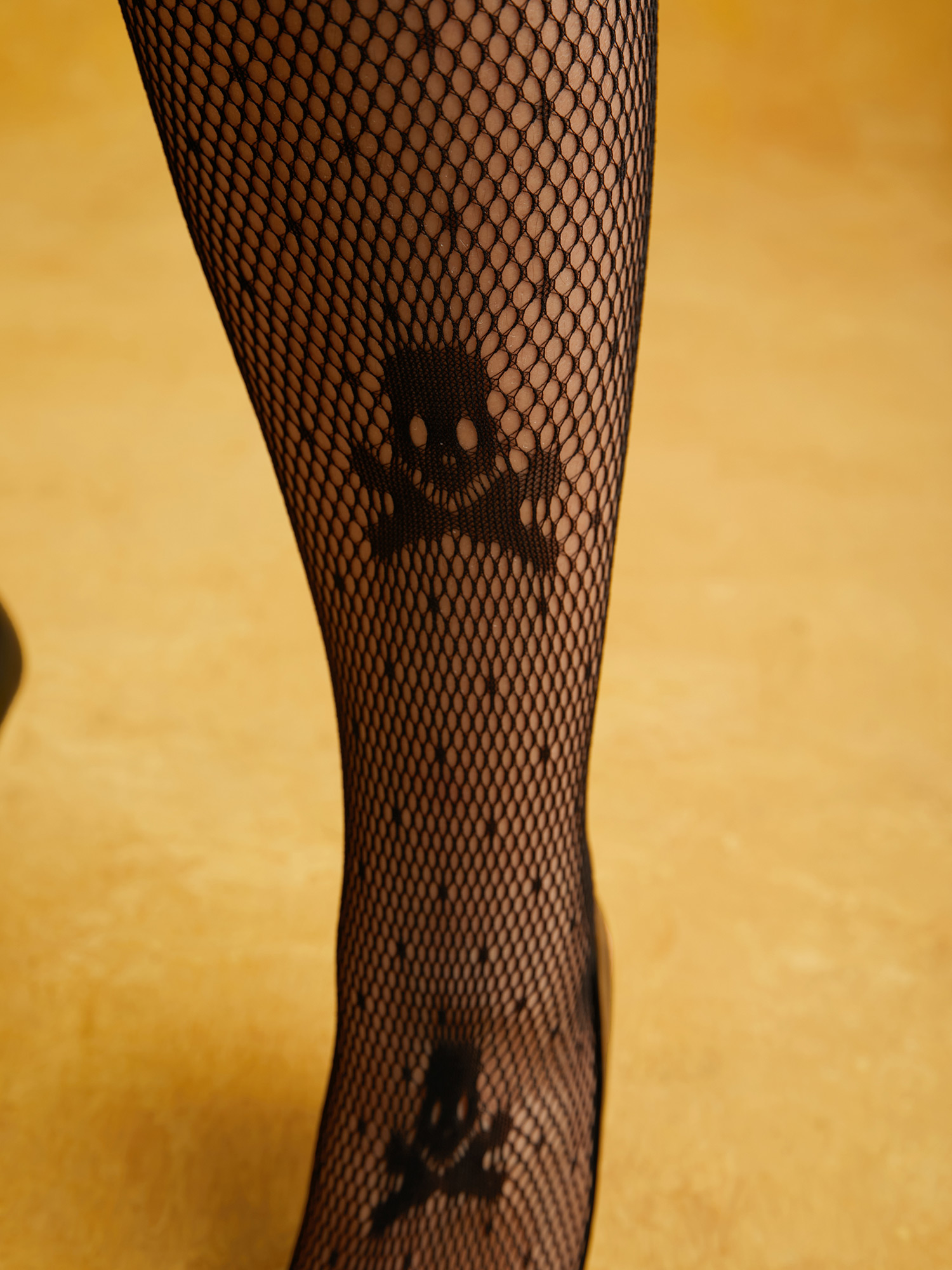 Side view of Skeleton Motif Sheer Stockings