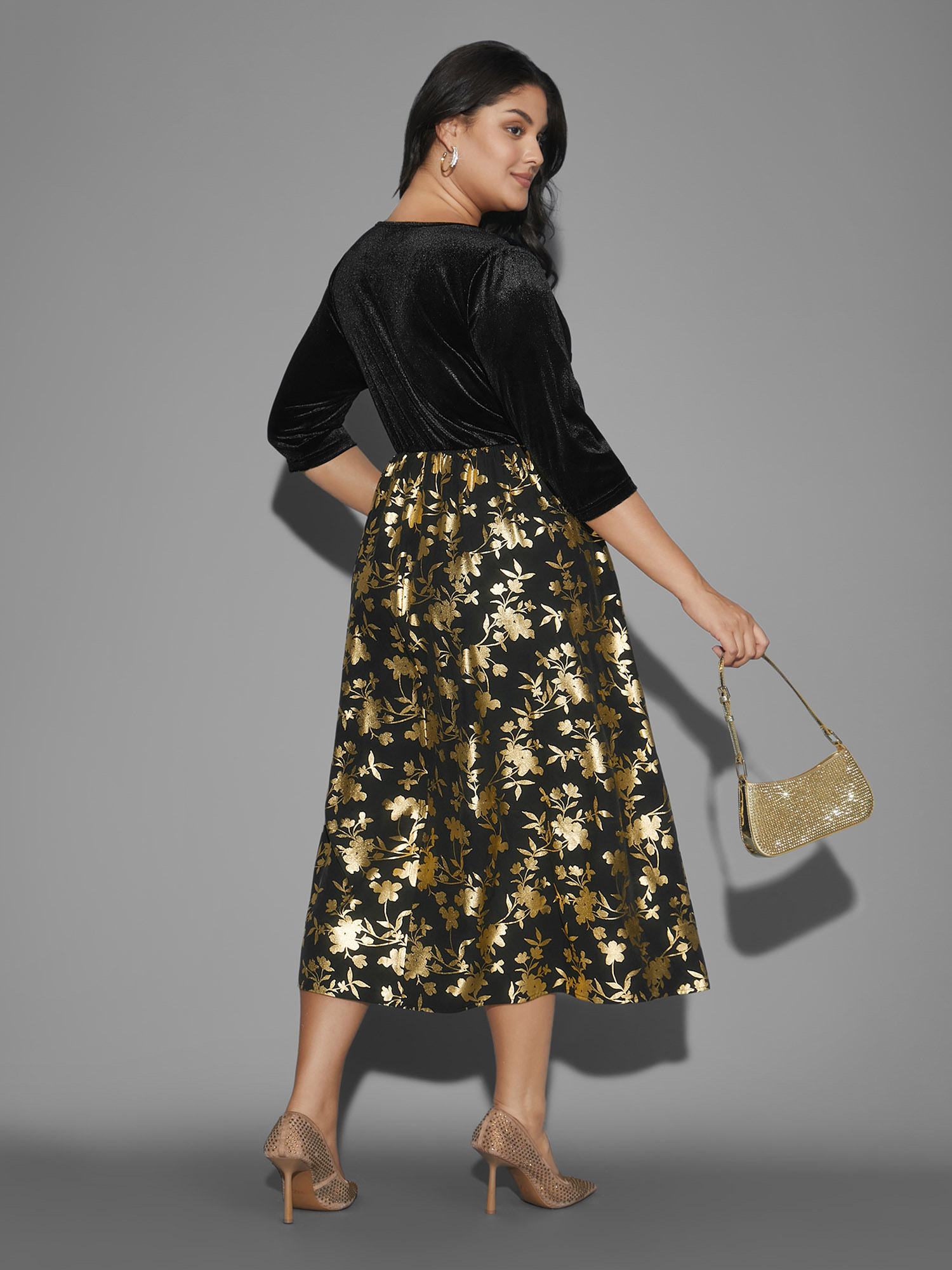 Side view of BloomChic Women's Plus Size Glitter Floral Patchwork Velvet Midi Dress Black Party 22-24/3X
