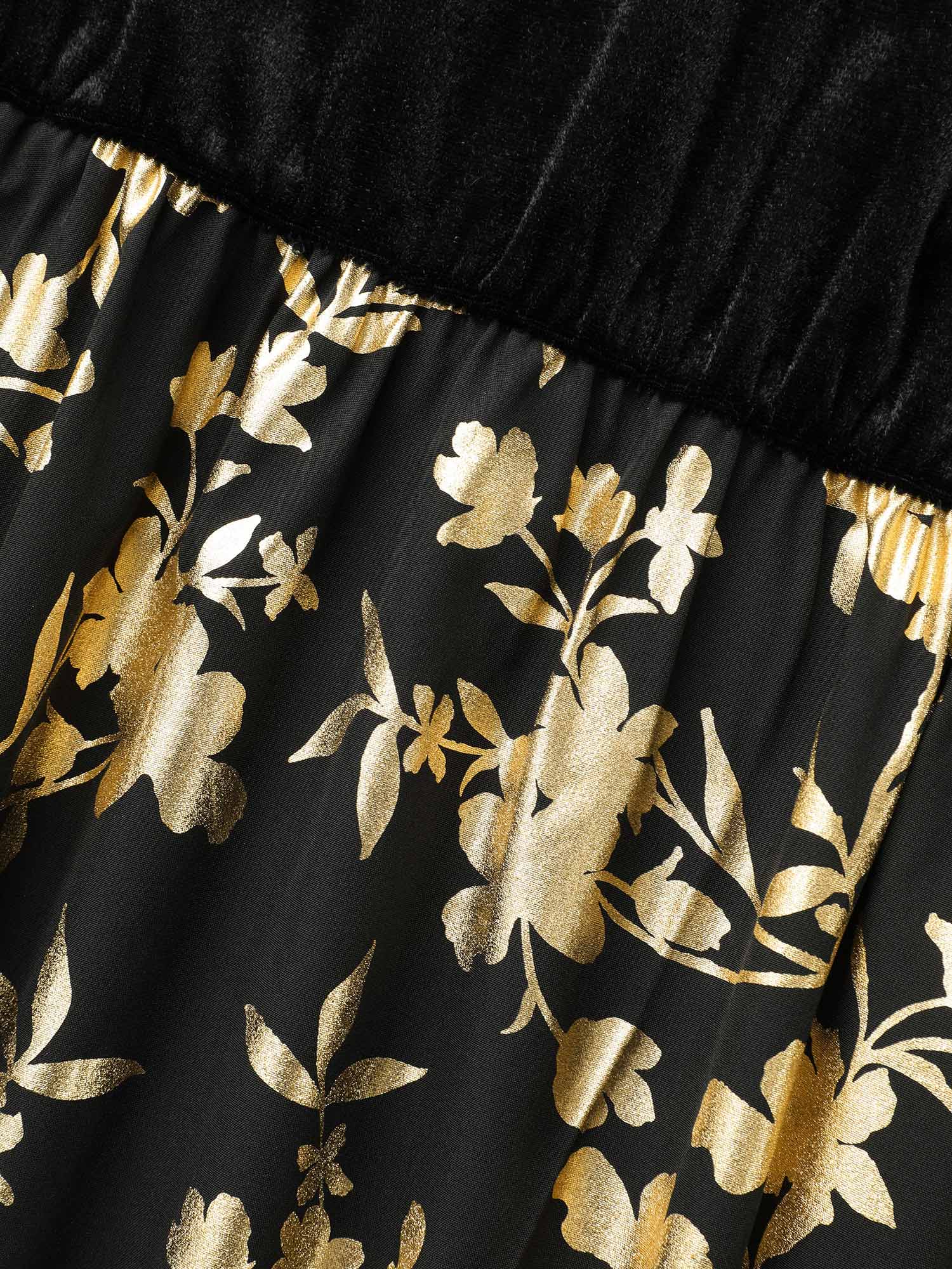Side view of BloomChic Women's Plus Size Glitter Floral Patchwork Velvet Midi Dress Black Party 22-24/3X