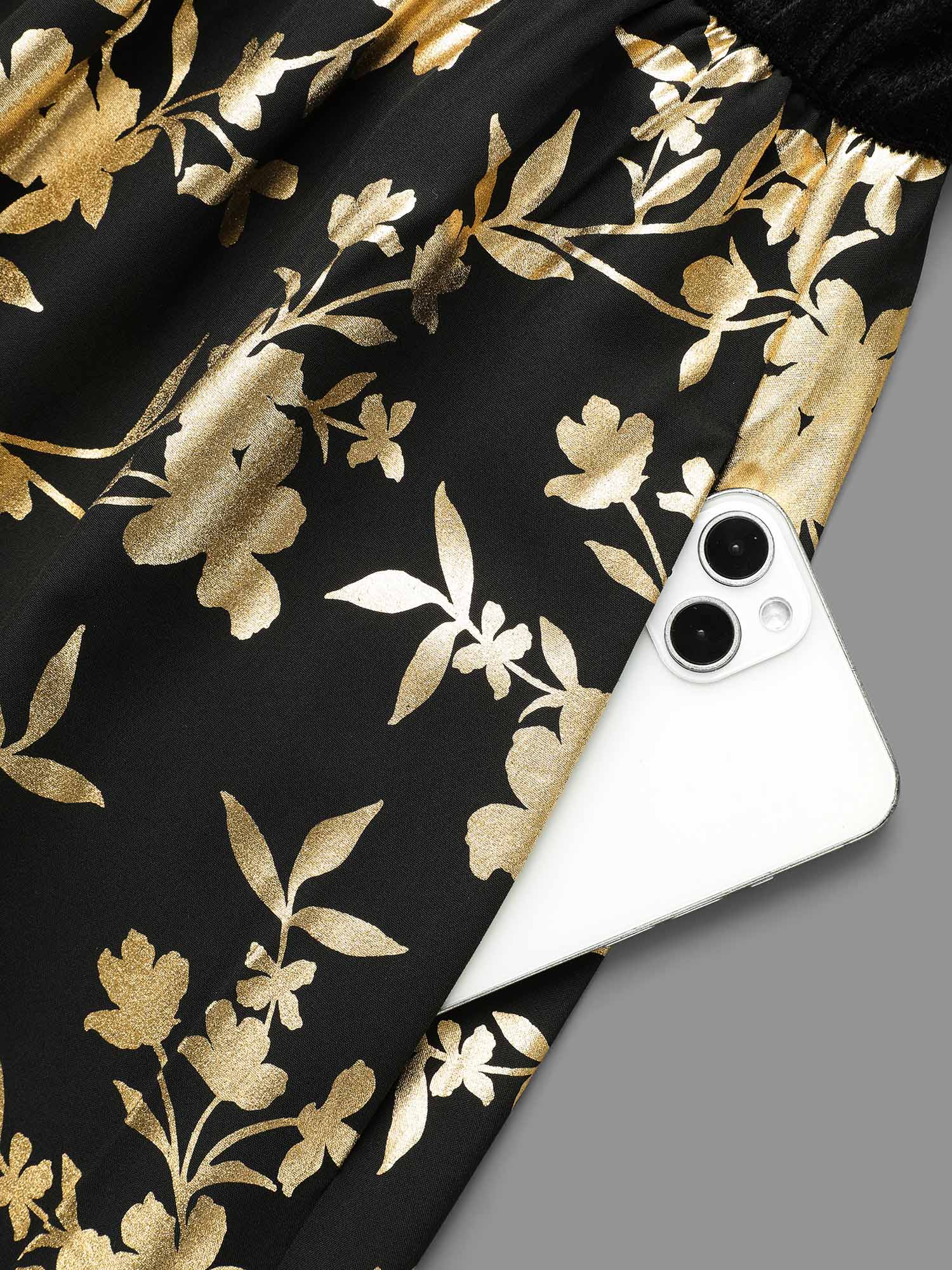 Side view of BloomChic Women's Plus Size Glitter Floral Patchwork Velvet Midi Dress Black Party 22-24/3X
