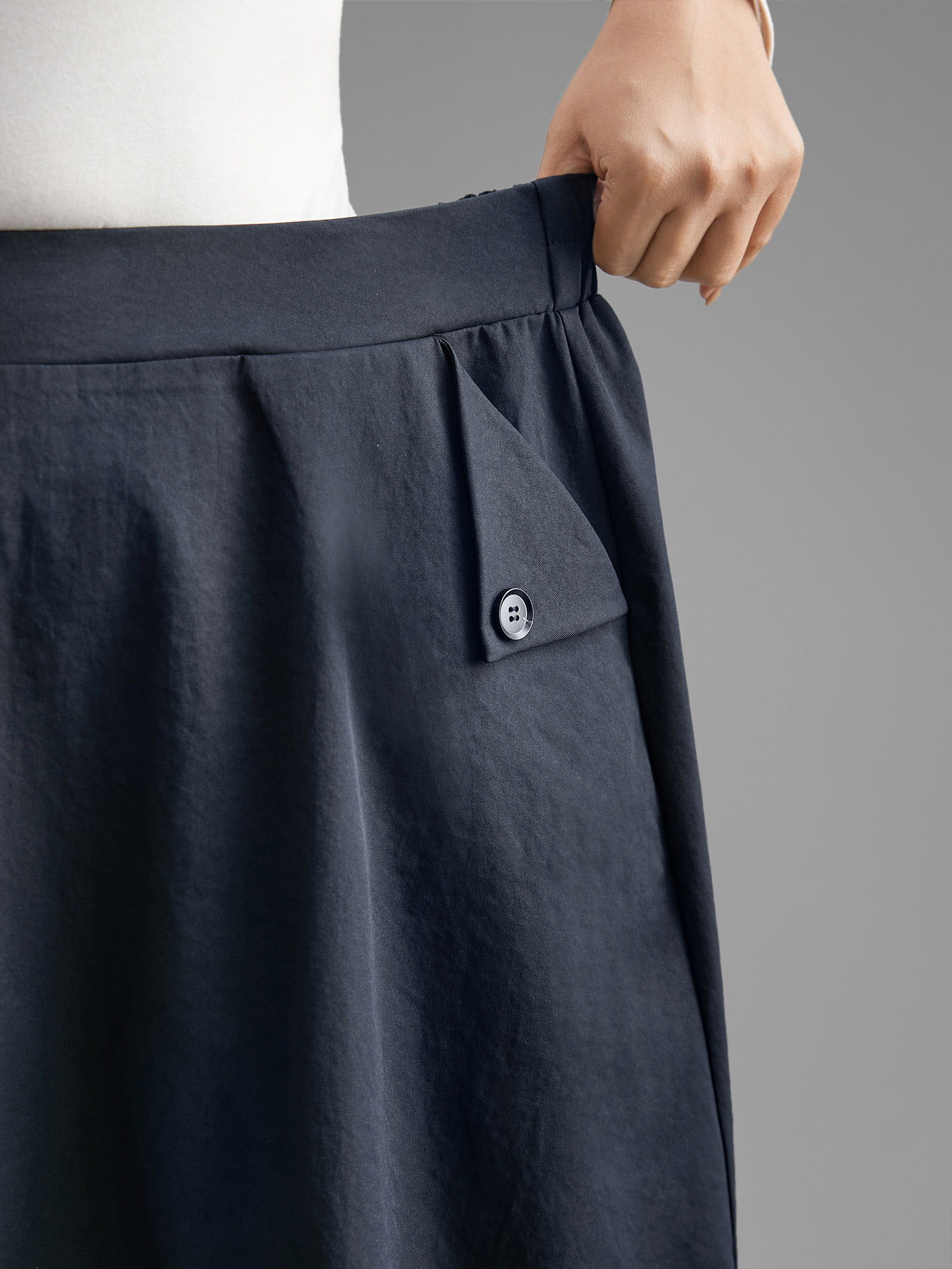 

Plus Size Solid Buckle Detail Pocket Skirt Women Indigo Elegant Button Low stretch Slanted pocket Everyday Skirts BloomChic