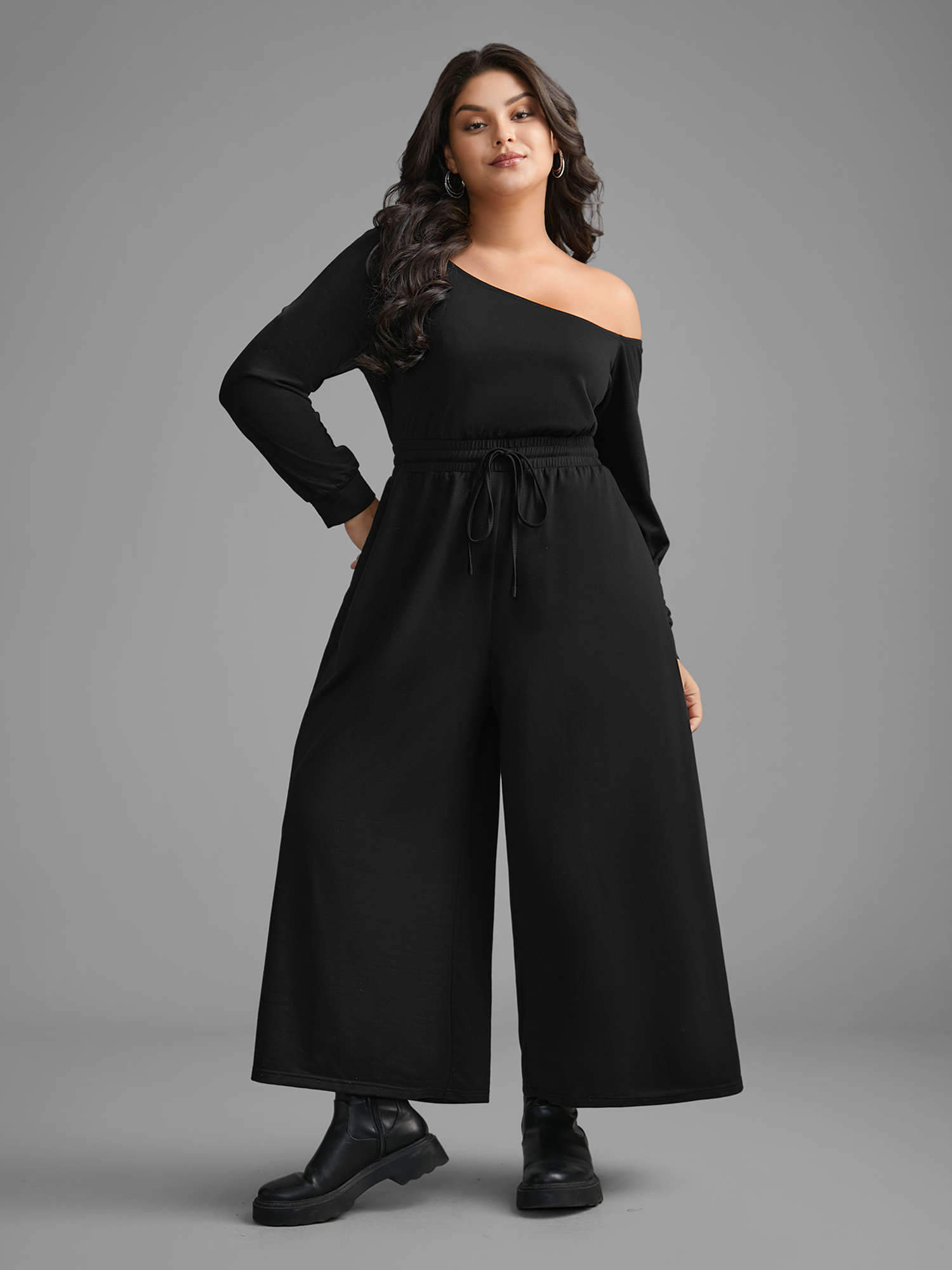 

Plus Size Black Textured Sheer Hollow Sleeves Jumpsuit Women Casual Long Sleeve Asymmetrical Neck Everyday Loose Jumpsuits BloomChic