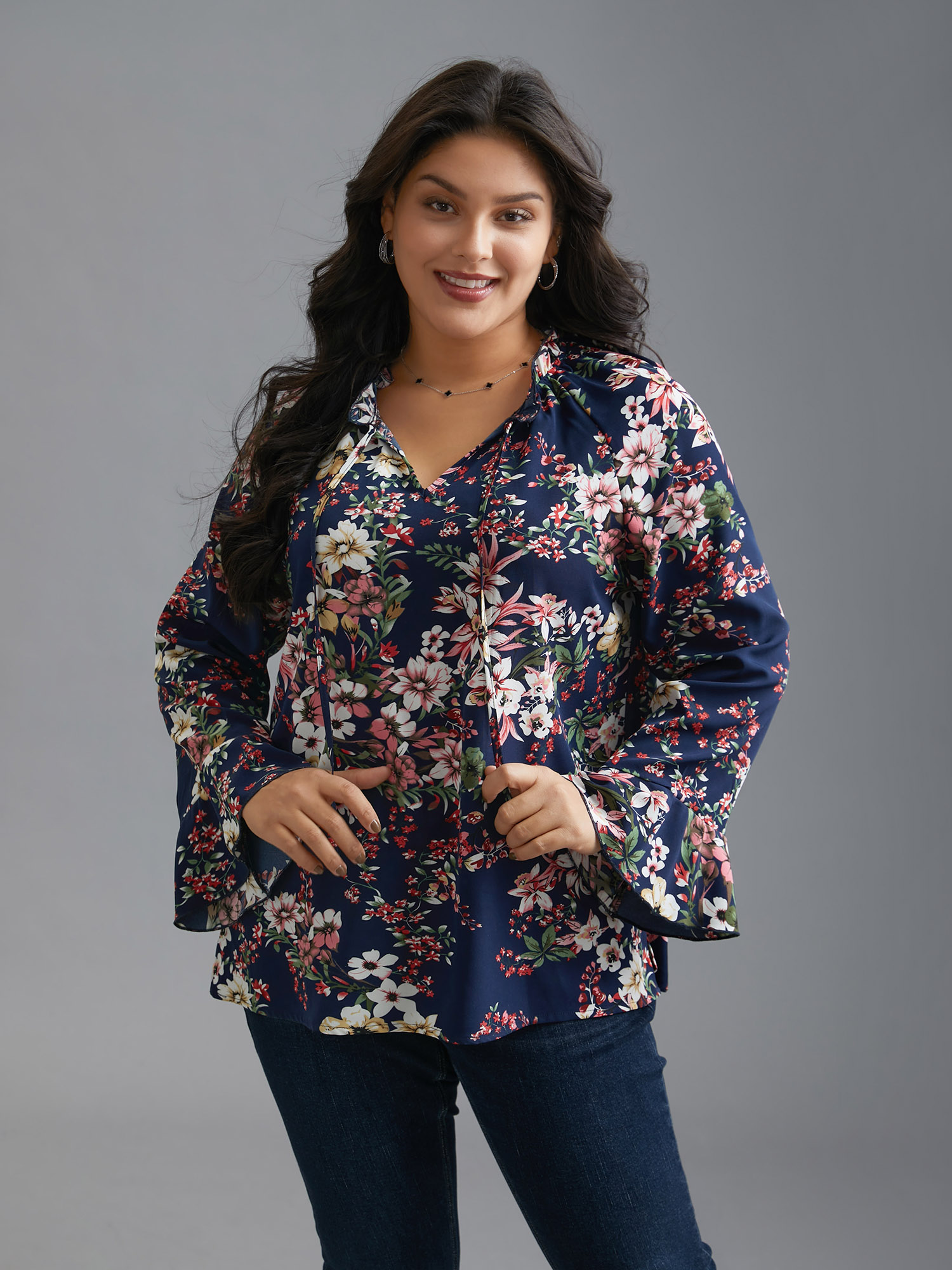 

Plus Size Indigo Floral Tie Knot Flutter Sleeve Blouse Women Elegant Long Sleeve V-neck Everyday Blouses BloomChic