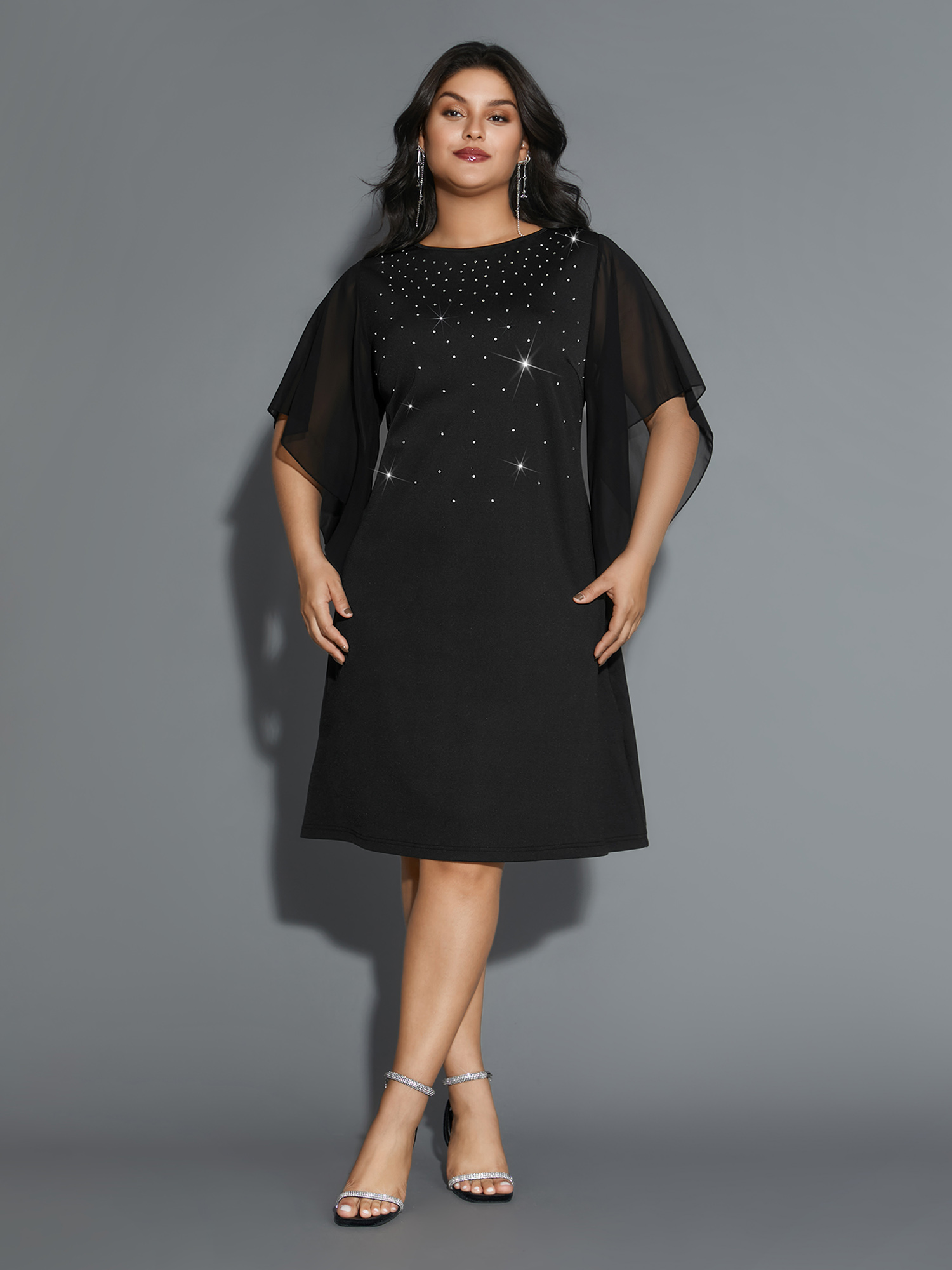 Side view of BloomChic Women's Plus Size Rhinestone Ruffle Sleeve Mesh Patchwork Dress Pureblack Party Mini Rhinestone detailing Round Neck 28/5X