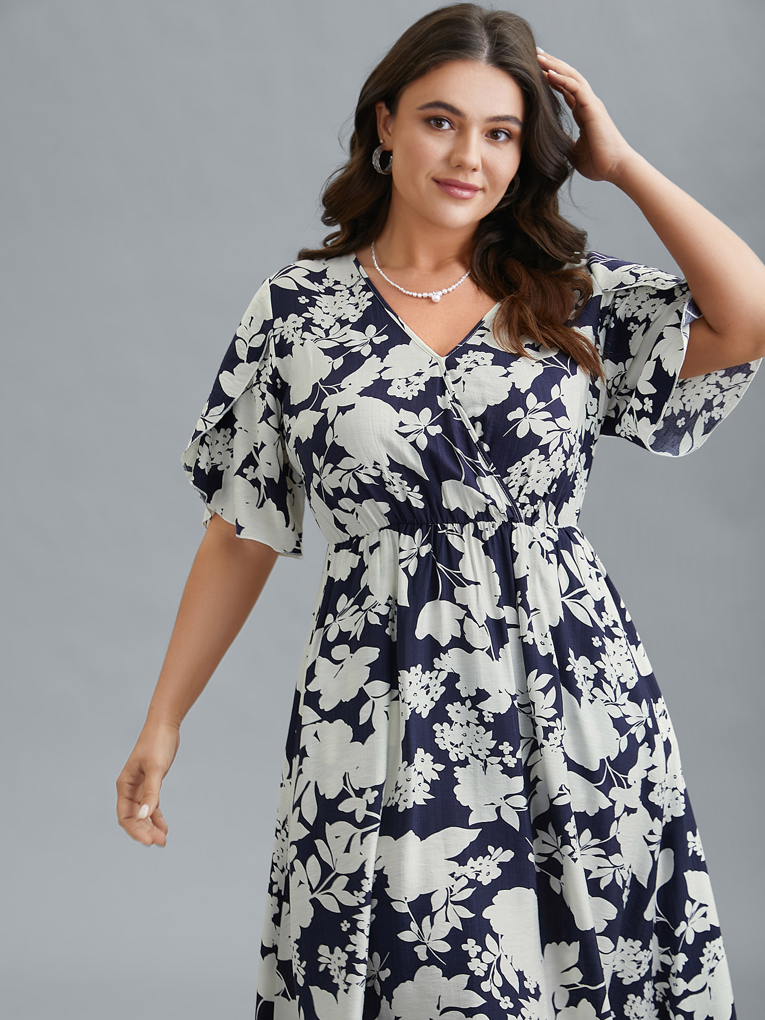 

Plus Size Floral Surplice Neck Petal Sleeve Midi Dress Indigo Women Elegant Gathered Overlap Collar Half Sleeve Curvy BloomChic