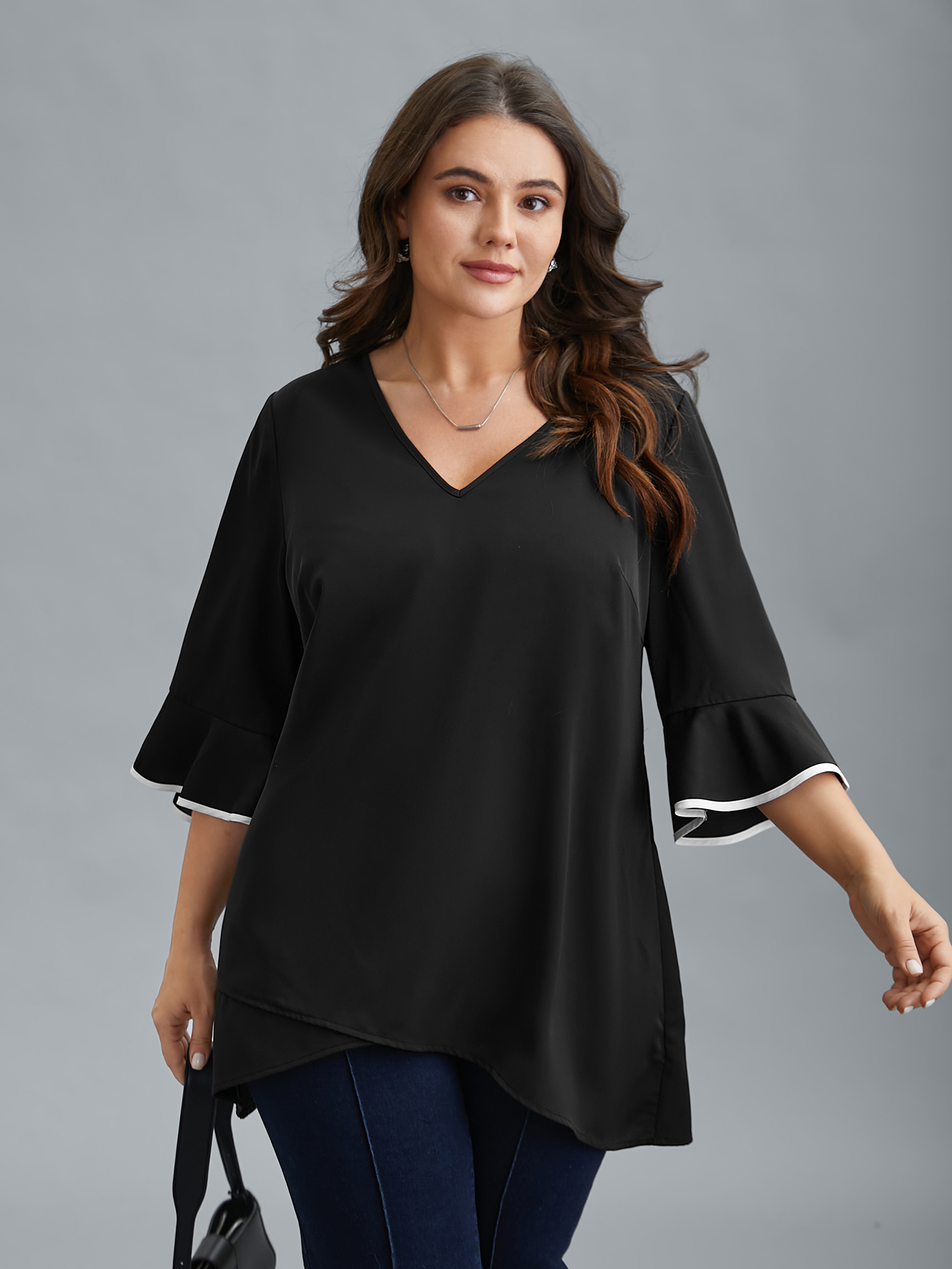 

Plus Size Black Color-Block Spliced Ruffled Overlap Hem Blouse Women At the Office Elbow-length sleeve V-neck Work Blouses BloomChic