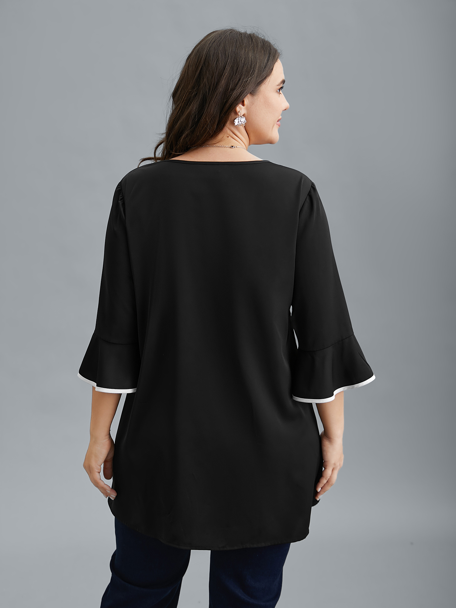 

Plus Size Black Color-Block Spliced Ruffled Overlap Hem Blouse Women At the Office Elbow-length sleeve V-neck Work Blouses BloomChic