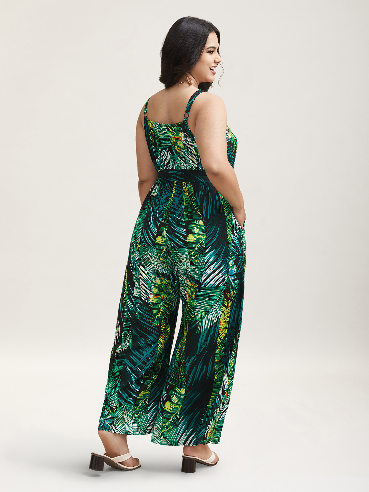 Plus Size BlackFlower Tropical Leaf Print Stretchy Belted Slit Jumpsuit Women Resort Sleeveless Overlap Collar Vacation Loose Jumpsuits BloomChic 28/5X 