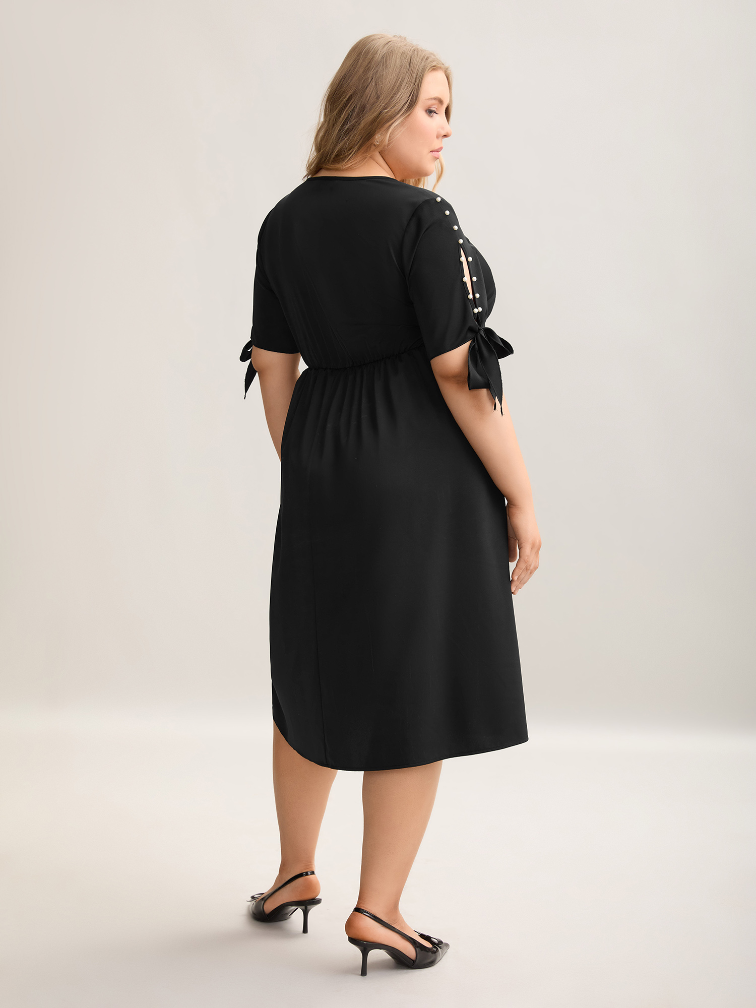 

Plus Size Cut-Out Sleeve Beaded Pockets Midi Dress Black Women At the Office Tie knot V-neck Short sleeve Curvy BloomChic