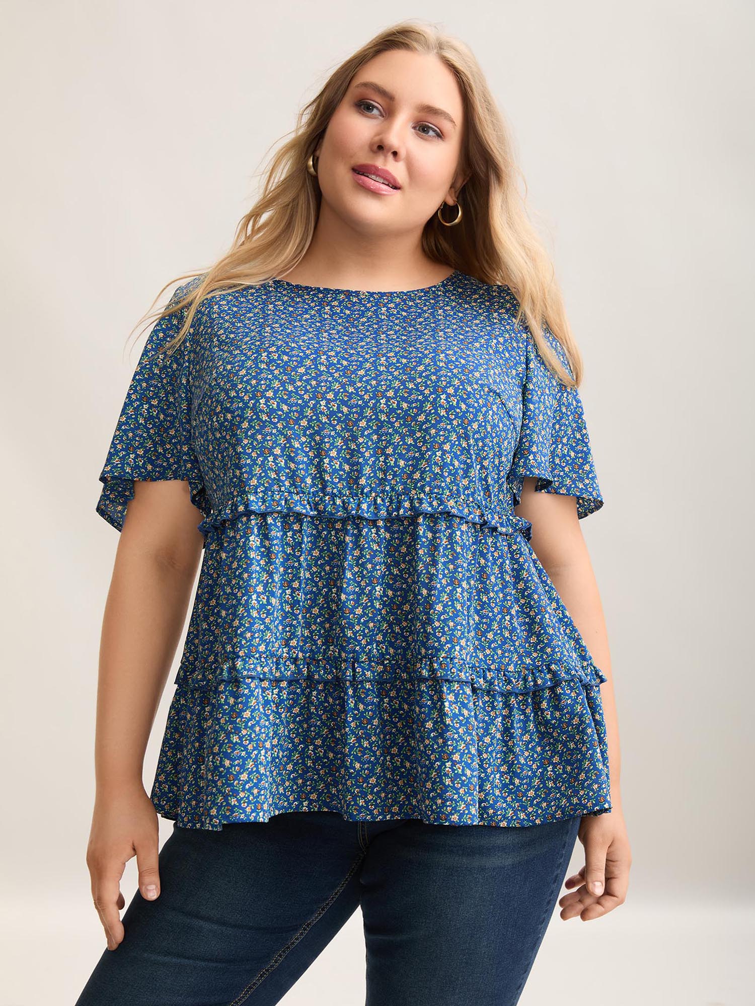 

Plus Size Mediumblue Ditsy Floral Print Ruffled Tiered Blouse Women Elegant Short sleeve Round Neck Everyday Blouses BloomChic