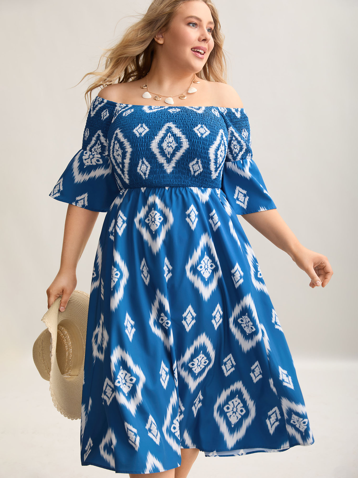 

Plus Size Bandana Print Off-Shoulder Pockets Midi Dress Aegean Women Resort Shirred One-shoulder neck Elbow-length sleeve Curvy BloomChic