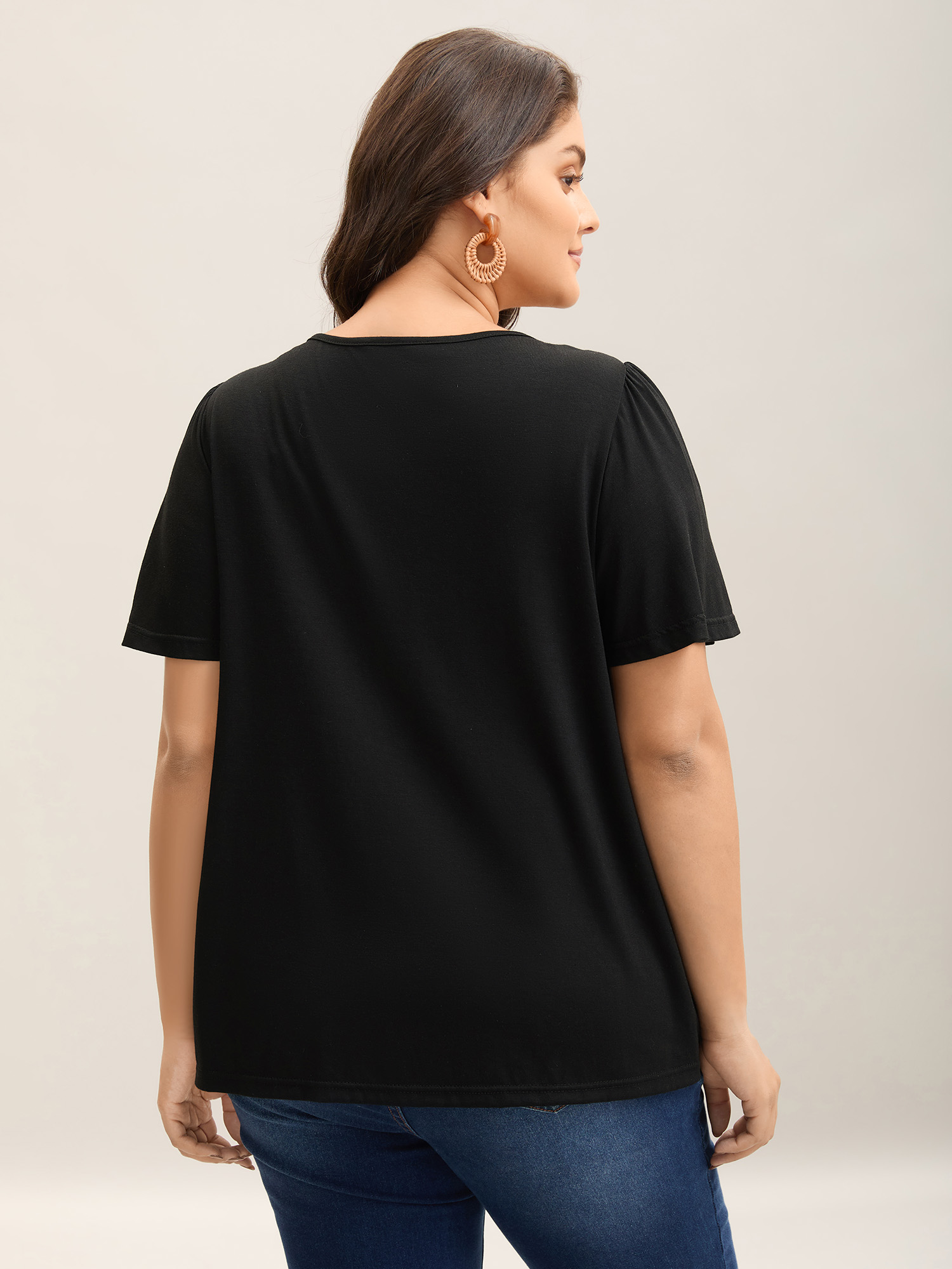 

Plus Size Embroidered Neckline Pleated Knit Top Black Round Neck Short sleeve Resort Jersey Tops