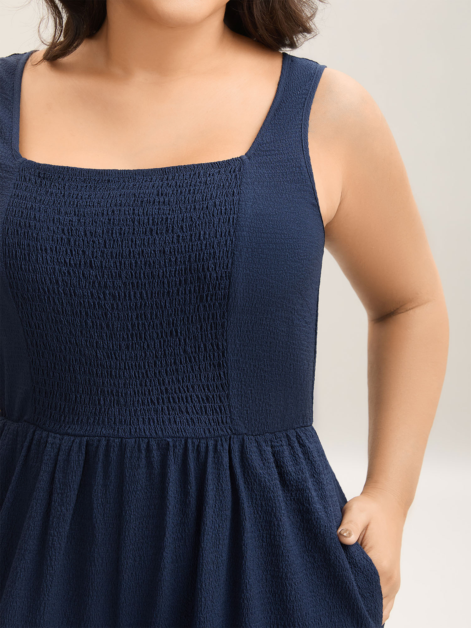 Side view of BloomChic Women's Plus Size Shirred Pockets Wide-Leg Plain Jumpsuit Midnight Vacation 30/6X