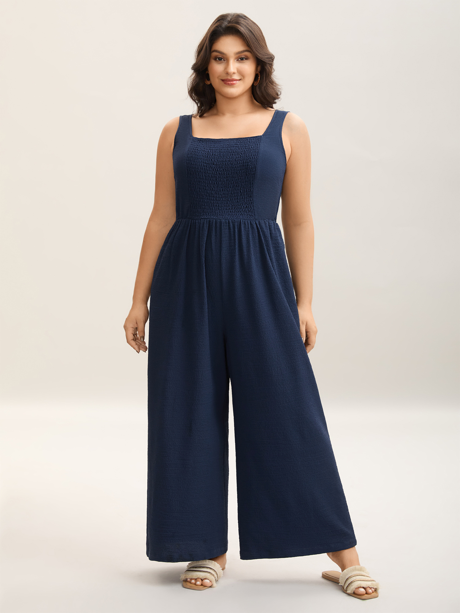 Side view of BloomChic Women's Plus Size Shirred Pockets Wide-Leg Plain Jumpsuit Midnight Vacation 30/6X