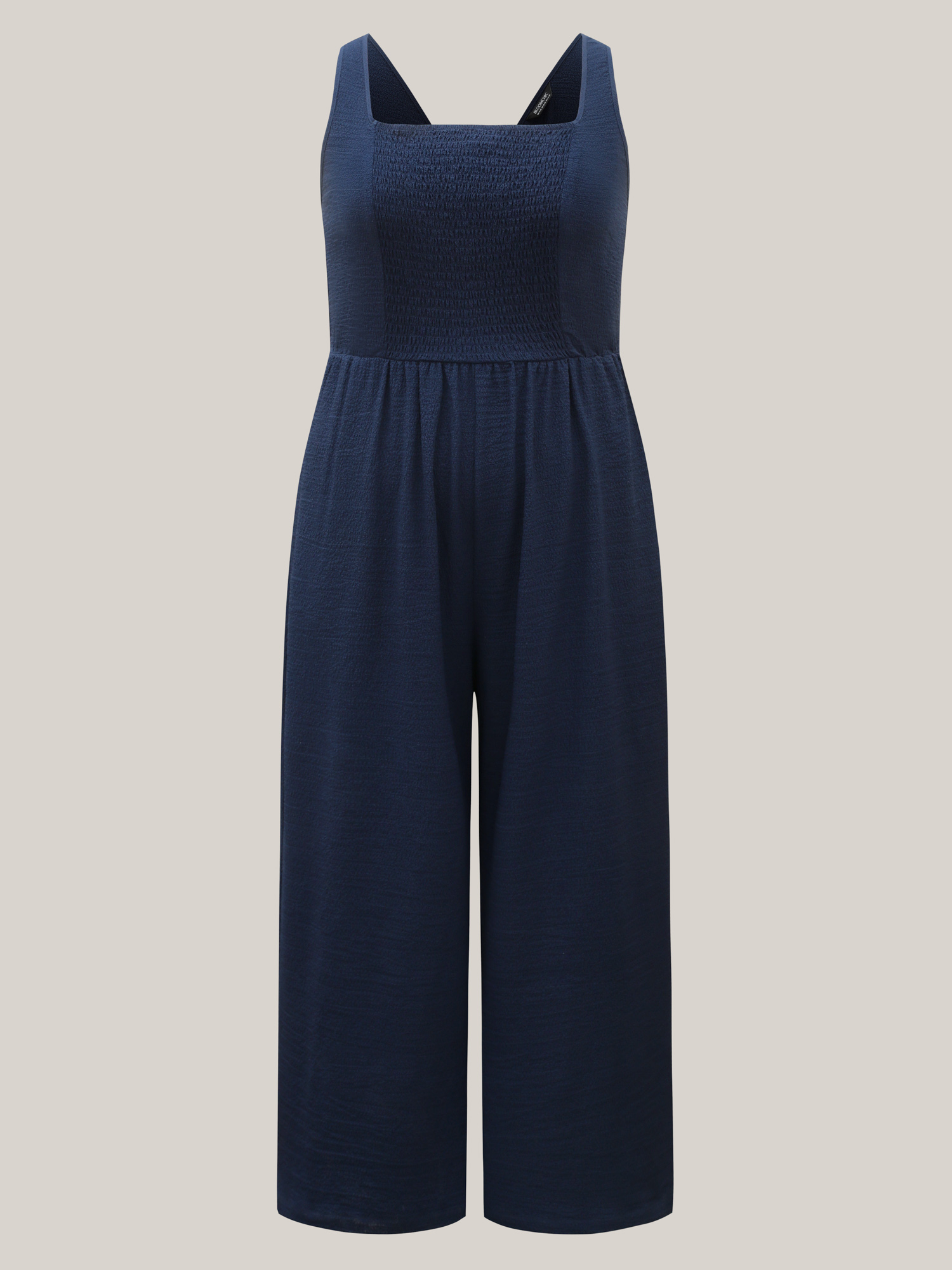 Side view of BloomChic Women's Plus Size Shirred Pockets Wide-Leg Plain Jumpsuit Midnight Vacation 30/6X