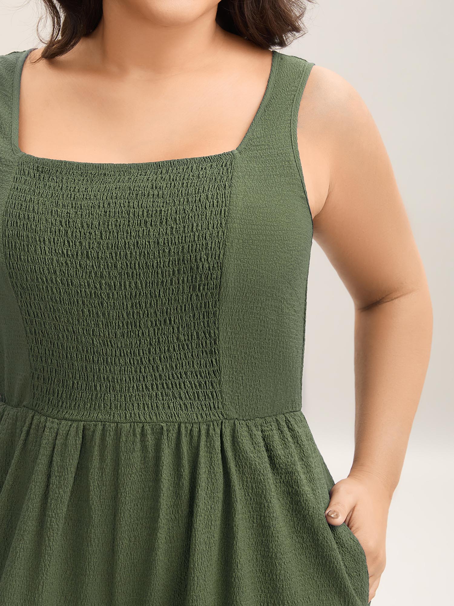 Side view of BloomChic Women's Plus Size Shirred Pockets Wide-Leg Plain Jumpsuit ArmyGreen Vacation 26/4X