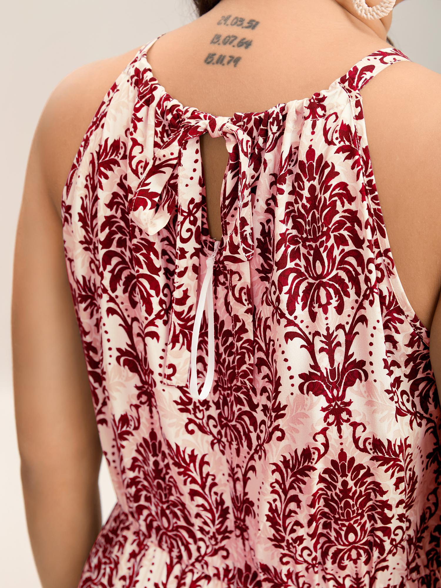 Side view of BloomChic Women's Plus Size Rayon Damask Print Stretchy Waist Jumpsuit Rust Vacation 10/M
