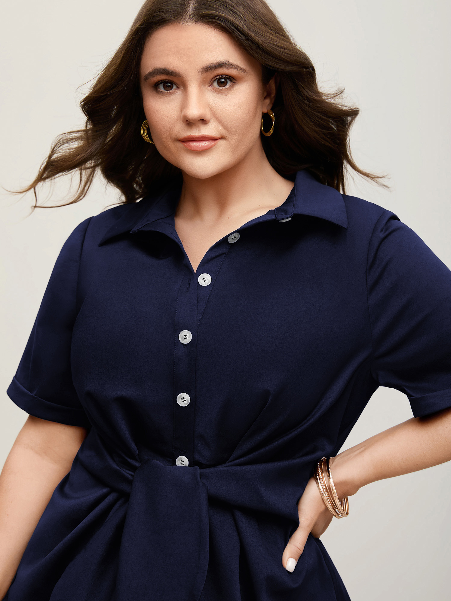 BloomChic Women's Plus Size Knotted Front Asymmetrical Hem Blouse Ocean Cavern Solid Office Short sleeve Collared Neck 10/M
