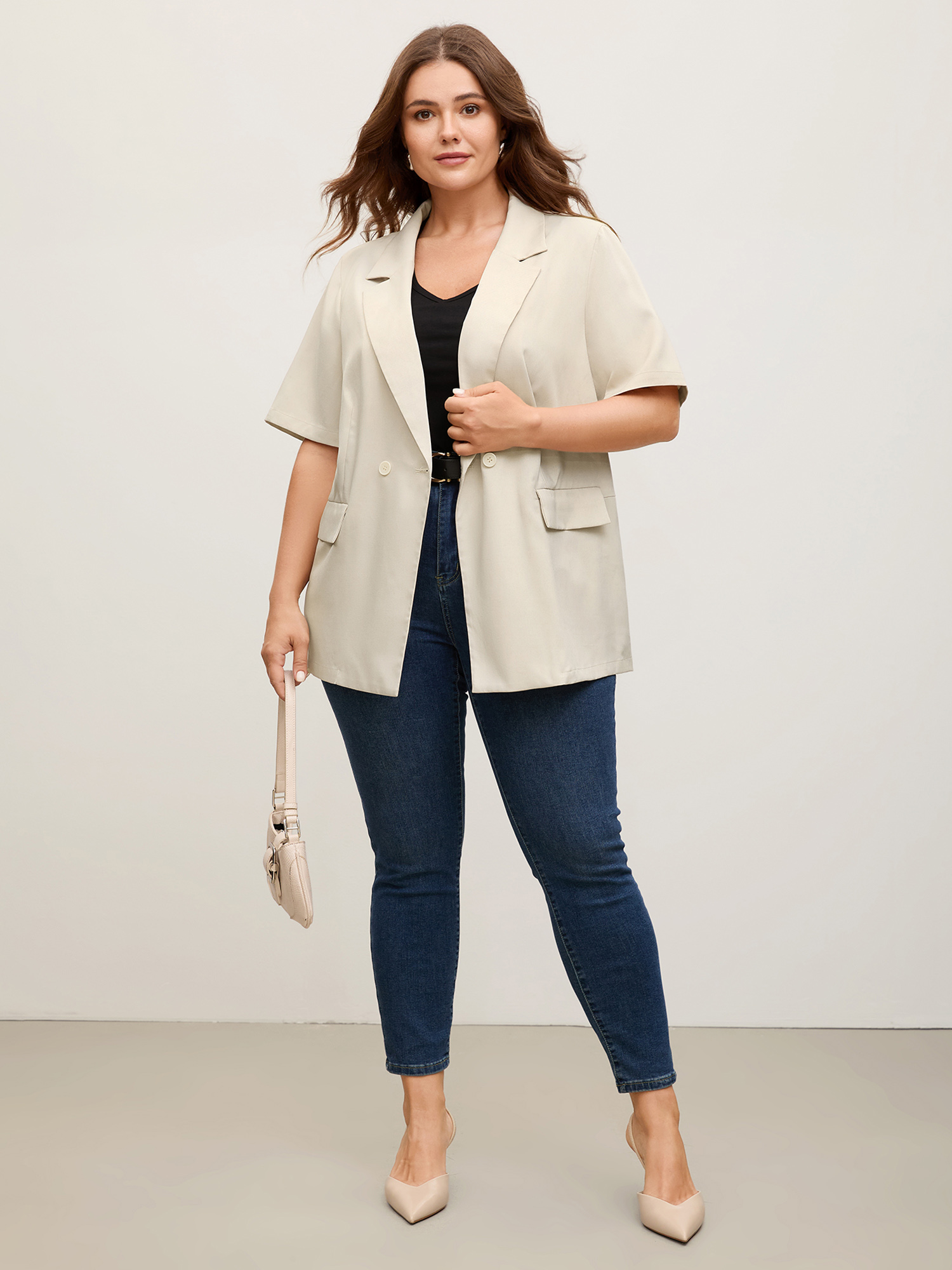 Side view of BloomChic Women's Plus Size Short Sleeve Pockets Solid Blazer Apricot Button Sleeve Short sleeve 12/L